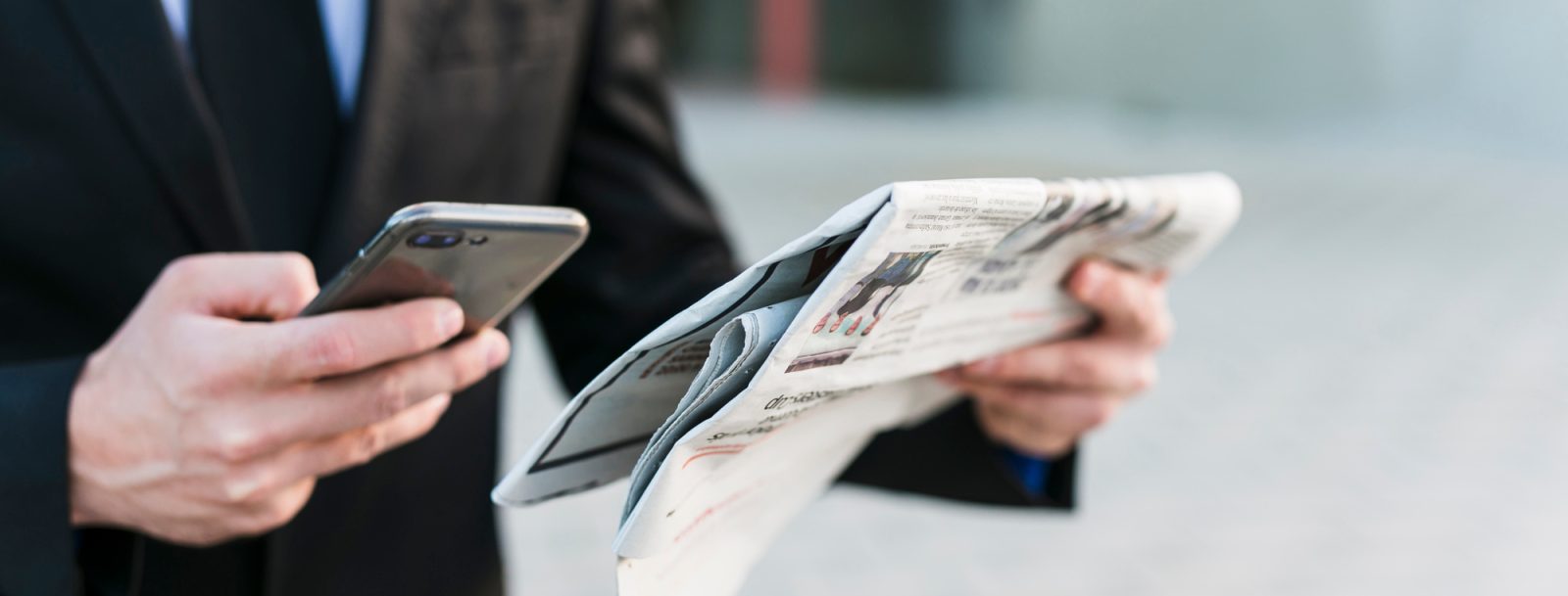 business-man-using-his-mobile-phone